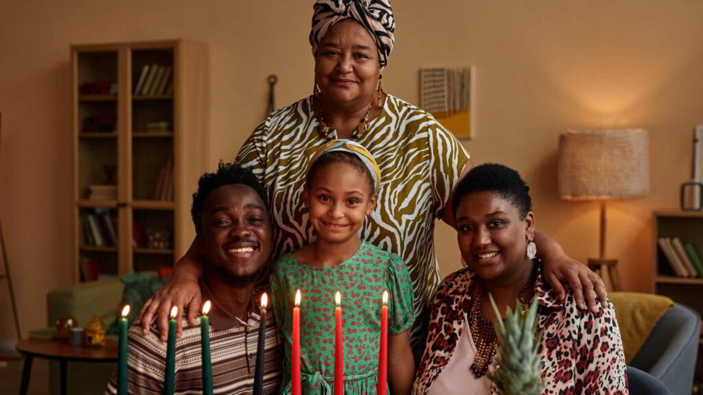 Celebrating Kwanzaa: Embracing Our Roots and Honoring Our Powerful Legacy. 2 optimized happy black family celebrating kwanzaa